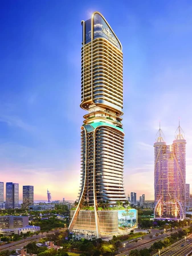 Shahrukhz: a slender gold-lit tower standing over the Dubai skyline at dusk.